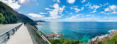 Full HD wallpaper background coastline walkway path along crystal clear sea, blue sky with white cloud beautiful seascape panorama. Rock composition of nature coast view.の写真素材