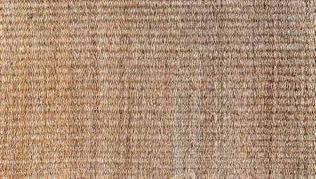 Abstract copy space seamless background texture. Horizontal close-up photography of the handmade jute mat. Reed mat, burlap mat. Chantaburi, Thailand.の写真素材