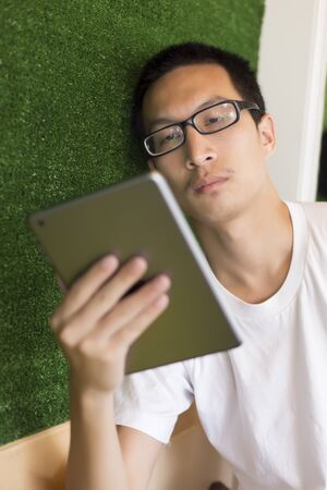 Man use tablet in cafeの写真素材