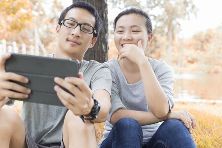 Couple use tabletの写真素材