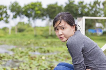 Woman sit on a river,Aloneの写真素材