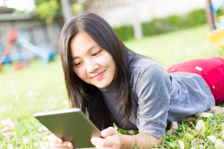 Woman Use Tablet for Relaxation at Playground