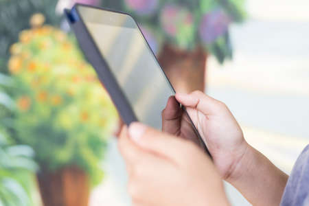 Woman Using Tablet: Close Upの写真素材