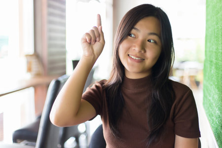 Happy Woman Thinking at Cafeの写真素材