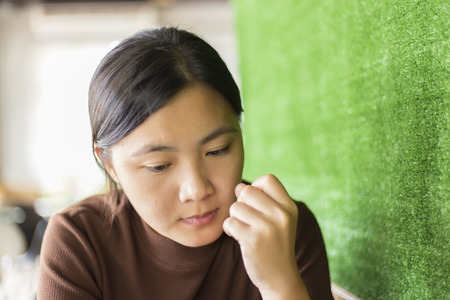 Lonely Girl Thinking at Cafeの写真素材