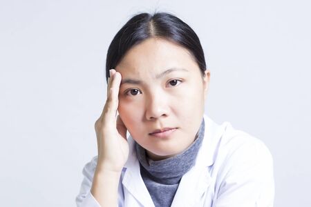 The Emotional of Woman Sciencetist: Head Achの写真素材