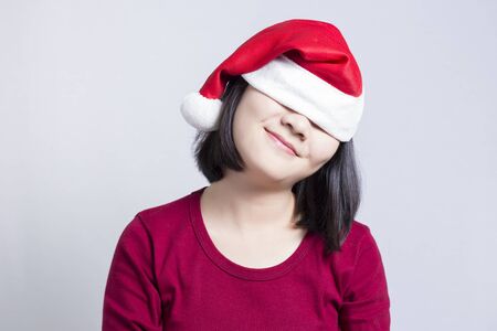 Woman Close Her Eyes So Excited in Christmas Dayの写真素材