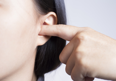 Woman Picking Her Earの写真素材