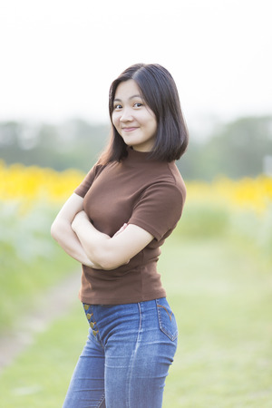 Woman with Relax Time at Sunflower Fieldの写真素材