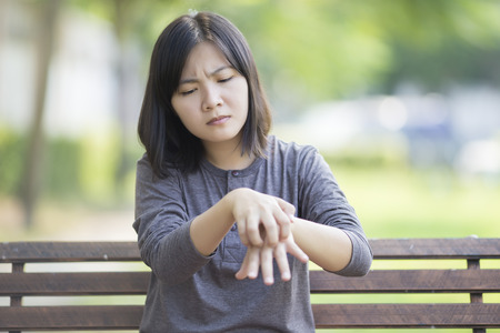 Woman Scratching Her Handの写真素材