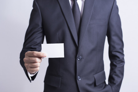 Businessman Pick Business Card: Isolated White Backgroundの写真素材