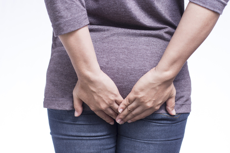 Woman Has Diarrhea Holding Her Butt on Isolated White Backgroundの写真素材