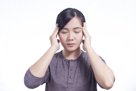 Woman Has Head Ache on Isolated White Backgroundの写真素材
