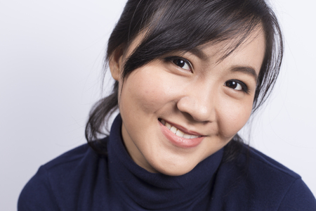 Portrait: Smile of woman on isolated white backgroundの写真素材