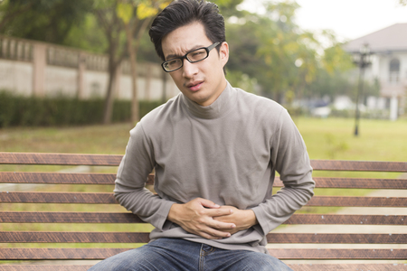 Man has stomach acheの写真素材