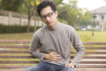 Man has stomach acheの写真素材