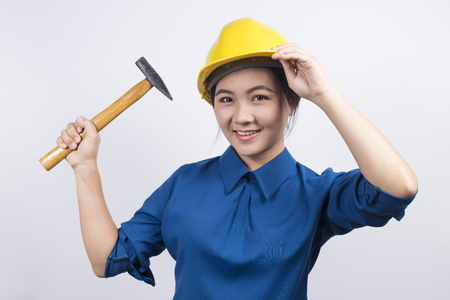 Engineer girl holding a hammerの写真素材