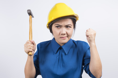 Engineer girl holding a hammerの写真素材