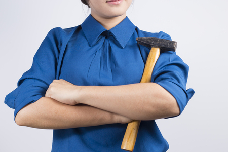 Engineer girl holding a hammerの写真素材