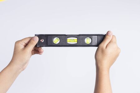 Engineer girl holding the water level rulerの写真素材