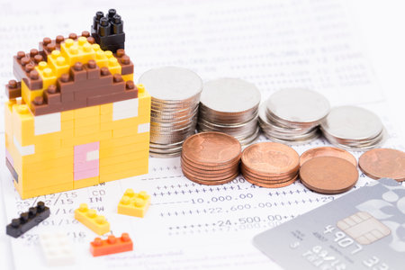 Finance Concepts, coin, lego and credit card with passbook as backgroundのeditorial素材