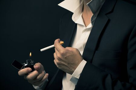 Businessman smoking a cigaretteの写真素材