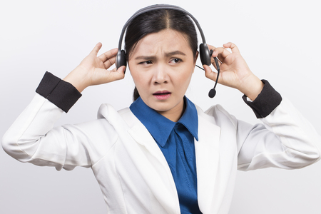 Operator or businesswoman in headset feel confuseの写真素材