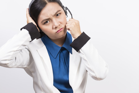 Operator or businesswoman in headset feel confuseの写真素材