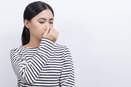 Woman touch her noseの写真素材
