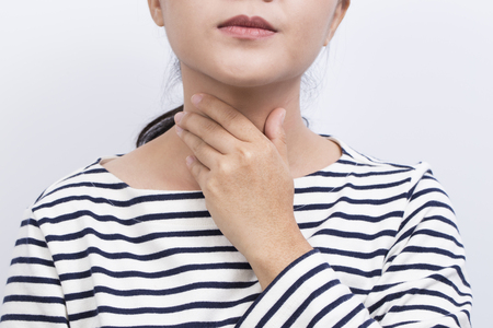 Woman has sore throatの写真素材