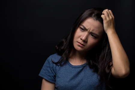 Angry woman on isolated black backgroundの写真素材