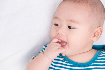 Adorable baby feel confuseの写真素材