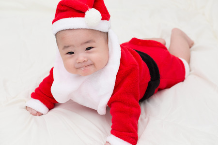 Baby in santa claus costumeの写真素材