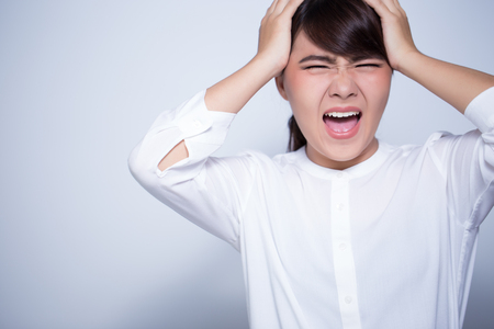 Angry woman on isolated backgroundの写真素材