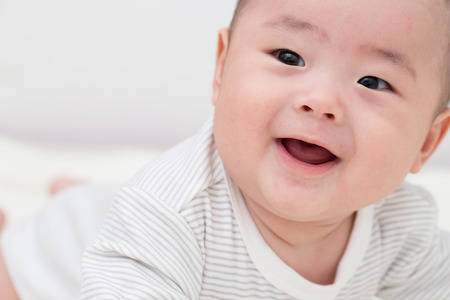 Portrait adorable baby smiling and surpriseの写真素材