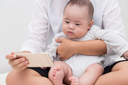 Mother and child watching a smartphone