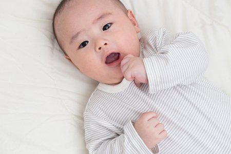 Portrait adorable baby smiling and surpriseの写真素材