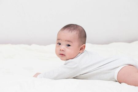 Portrait of thinking baby boyの写真素材