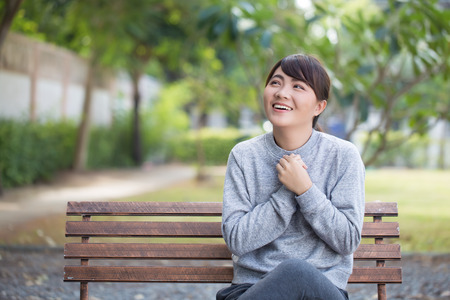 Woman with relax time at the parkの写真素材