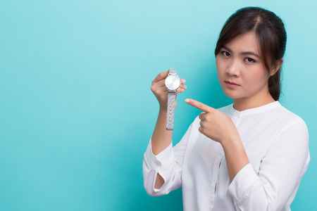 Asian woman ask "what time is it"の写真素材