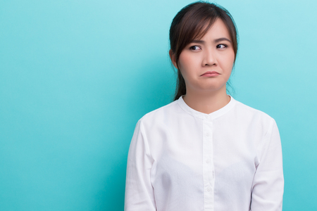 Serious woman on isolated backgroundの写真素材