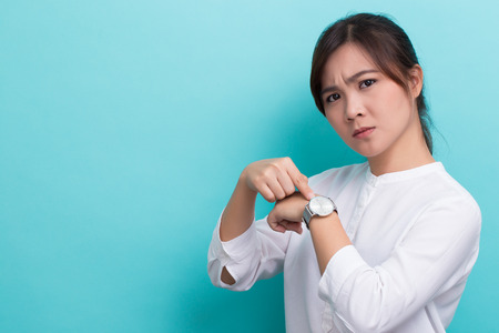 Asian woman ask "what time is it"の写真素材
