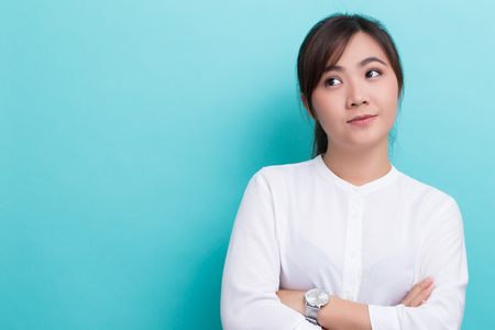 Asian woman thinking on isolated backgroundの写真素材