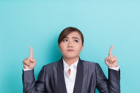 Serious woman on isolated backgroundの写真素材