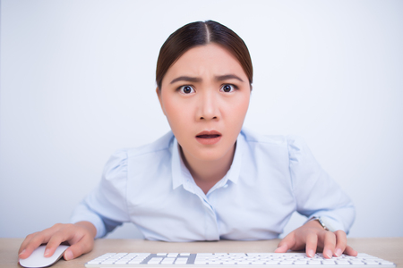 Asian woman surprise look at the cameraの写真素材