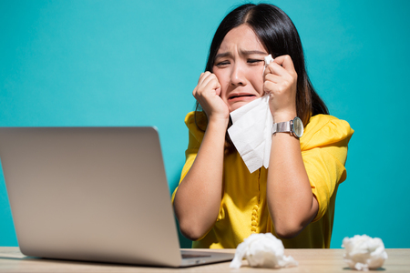 Woman so sad when she look at laptopの写真素材