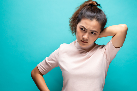 Tired woman has pain in neckの写真素材