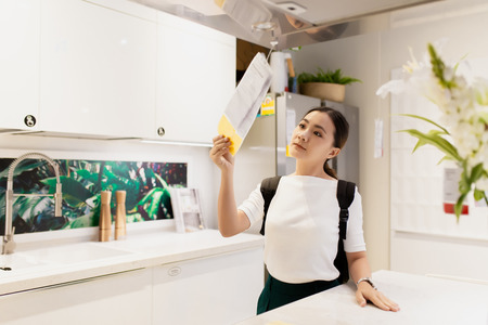 Woman shopping and choose the decorative for kitchen roomのeditorial素材