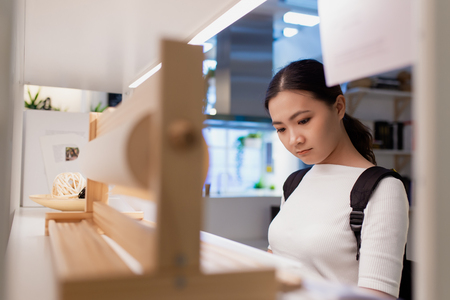 Woman shopping and choose the decorative for kitchen roomの写真素材