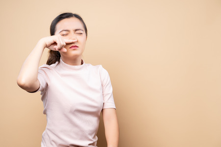 Woman wipe her nose and standing isolated overの写真素材